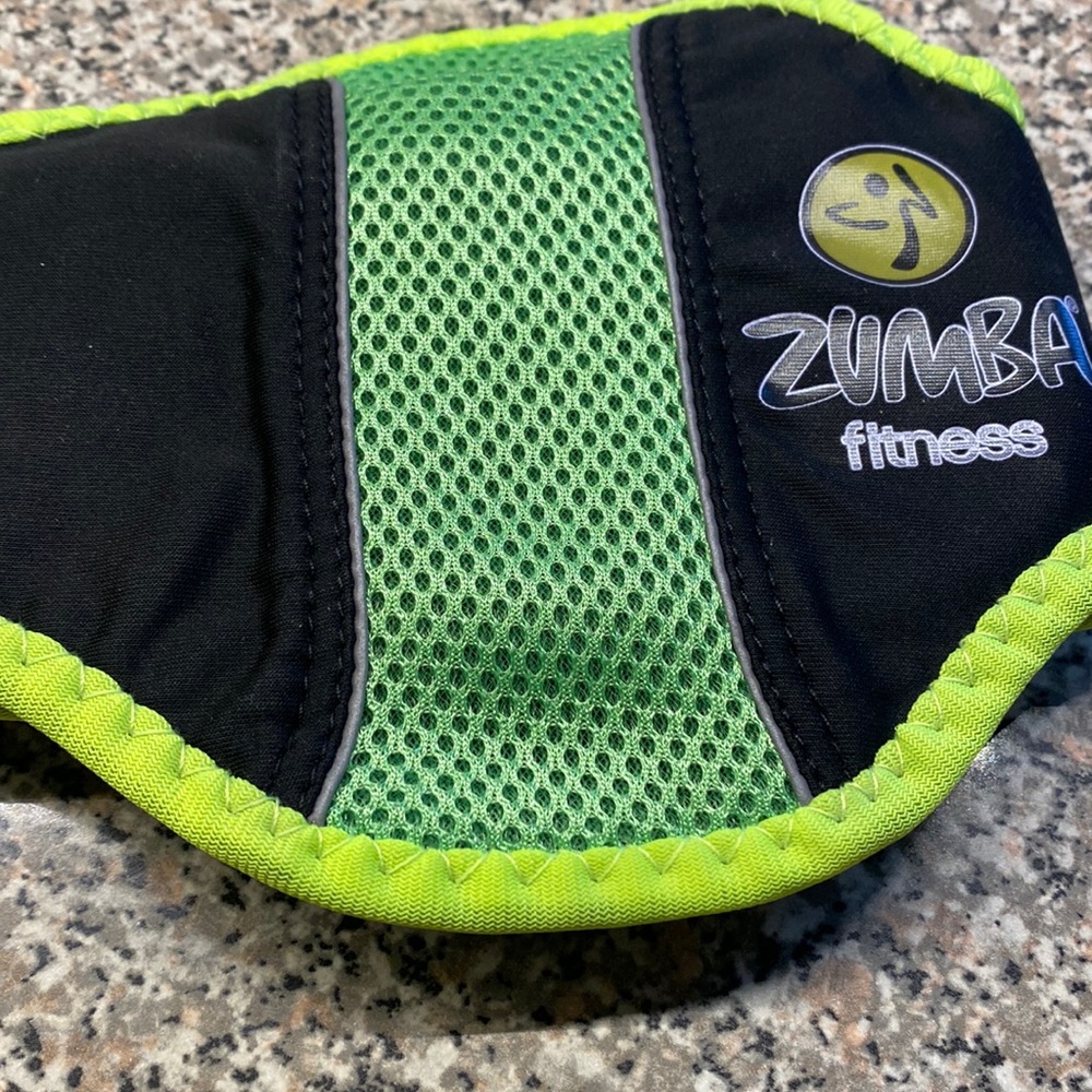 Zumba fitness belt with Velcro. Never worn. Still in the plastic bag.